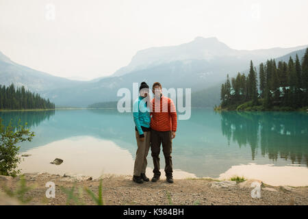 Portrait of hiker couple standing near the lake Stock Photo