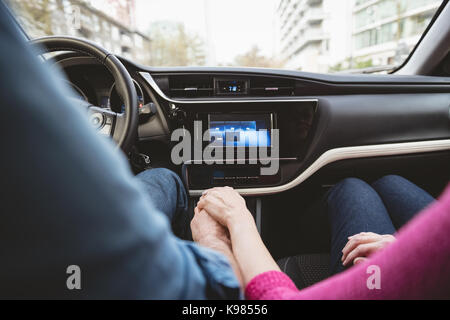 Romantic Couple Holding Hands While Driving Car Stock Photo Alamy