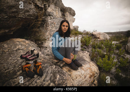 Portrait of confident woman wearing sports shoes Stock Photo