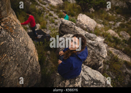 Portrait of confident woman standing on cliff Stock Photo