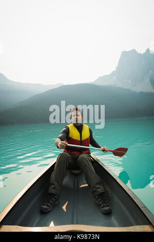 Portrait of man kayaking in lake Stock Photo