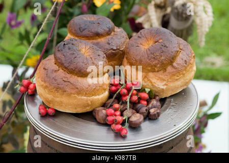 rustic cottage loaves on silver tray, ready for serving Stock Photo