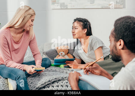 young students doing homework together Stock Photo