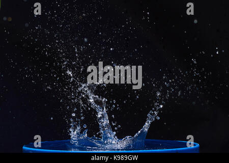 Blue water drops falling down. Stock Photo