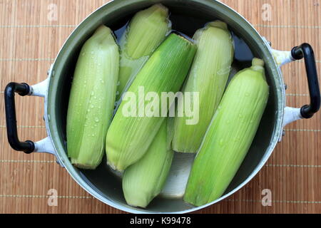 Corn in a pot ready for boiling Stock Photo