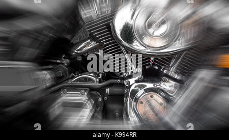 Jesolo (VE), ITALY - July 29, 2017: Motorcycle Harley Davidson. Motorcycle tank and engine's details. Radial blur action effect applied. Stock Photo