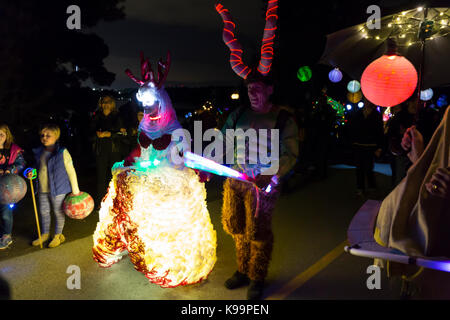Seattle, Washington, USA. 21st Sep, 2017. Performers in regal costume arrive at the terminus of the Luminata Lantern Parade. The Fremont Arts Council welcomes all to the procession around Green Lake to celebrate the autumnal equinox with illuminated costumes, lanterns and art. The procession begins at the Aqua Theater and ends at the Bathhouse Theater at a secret banquet with art and live music. The annual event held at dusk on the autumnal equinox is produced by the Fremont Arts Council, an organization that supports the arts and artists in and around the Fremont neighborhood of Seattle. Cred Stock Photo