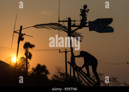 Pandeglang, Indonesia. 22nd Sep, 2017. A man climbs stairs to repair his windmill during traditional windmill festival at Tanjung Lesung, Pandeglang district, Banten Province in Indonesia, Sept. 22, 2017. Credit: Veri Sanovri) (zjy/Xinhua/Alamy Live News Stock Photo
