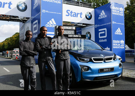Valary Aiyabei from Kenya, Gladys Cherono from Kenya and Amane Beriso from Ethiopia pose for the cameras at the starting line.  The leading male and female runners for the 44th BMW Berlin Marathon as well as two Guinness Worlds Records contestants posed for the cameras at the starting line of the marathon. Stock Photo
