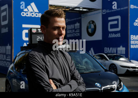 Philipp Pfleger from Germany poses for the cameras at the starting line.  The leading male and female runners for the 44th BMW Berlin Marathon as well as two Guinness Worlds Records contestants posed for the cameras at the starting line of the marathon. Stock Photo