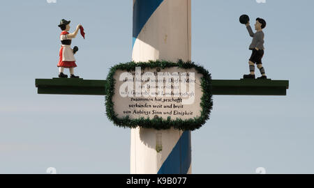 Detail view of traditional Maypole showing descriptive plaque and figurines, Aubing, near Munich, Germany, Europe. Stock Photo