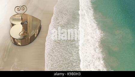 Digital composite of 3D Heart key box on beach Stock Photo
