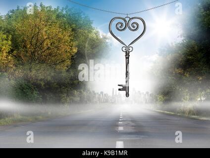 Digital composite of 3D Heart Key floating over road Stock Photo
