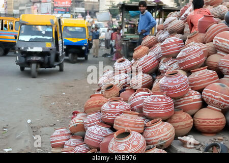 Earthenware pots by hand baked for sale on the stall by the street of one of Indian cities Stock Photo