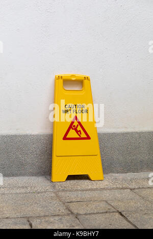 Yellow Warning Sign For Wet Floor Stock Photo