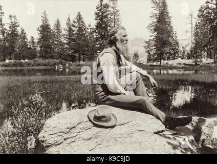 John Muir (1838-1914) naturalist whose passion for the preservation of wilderness areas in the United States conveyed through his writing helped establish Yosemite National Park and the US National Park Service. Photograph taken at Mirror Lake in Yosemite circa 1902. Stock Photo