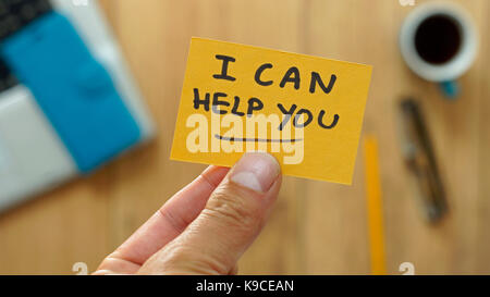 I can help you written on a card at the office Stock Photo
