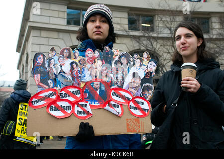 Washington DC, USA - January 20, 2017: Protesters gather as Donald Trump takes the oath of office and becomes the 45th President of the United States  Stock Photo