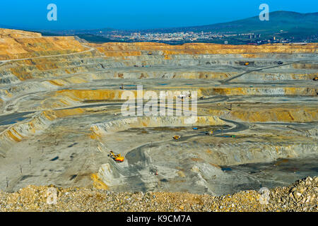 Benches of an open-pit copper mine of the Erdenet Mining Corporation EMC, city of Erdenet behind, Erdenet, Mongolia