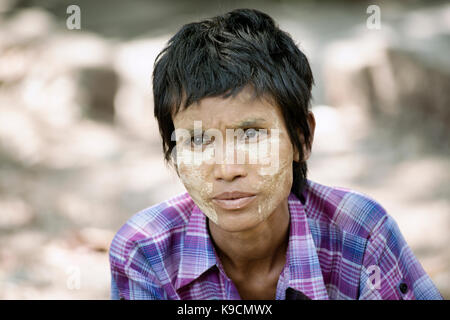 Close up portrait of a Birmese girl with traditional Tanaka face paint. February 22, 2014 - Yangon, Myanmar Stock Photo