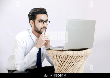 Indian young man with laptop Stock Photo
