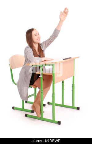 Teenager school girl raising hand to ask question isolated on white Stock Photo