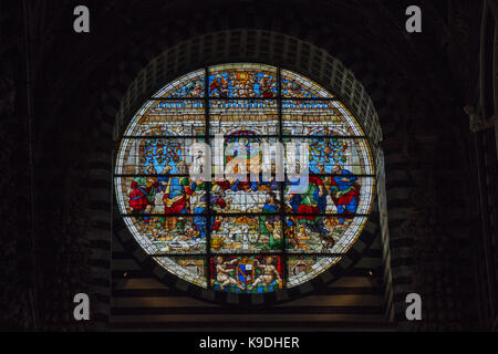 Italy, Siena - December 26 2016: interior view of Metropolitan Cathedral of Santa Maria Assunta. Stained glass window of the Duomo di Siena on Decembe Stock Photo