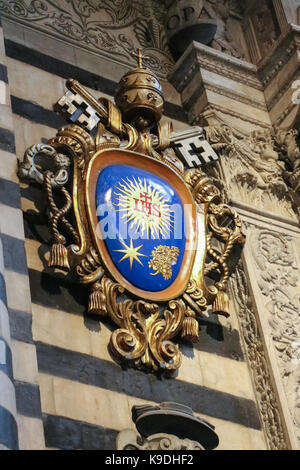 Italy, Siena - December 26 2016: the view of the Pope Francis coat of Arms at the entrance of the Duomo di Siena on December 26 2016 in Siena, Tuscany Stock Photo