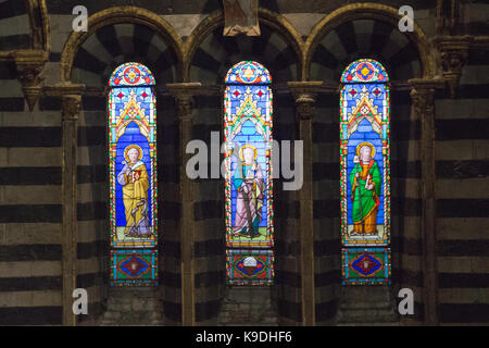 Italy, Siena - December 26 2016: the view of the stained glass window of the Siena Cathedral. View of cathedral interior from the passageway under the Stock Photo