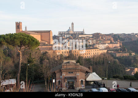 Italy, Siena - December 26 2016: the view of the Duomo di Siena from Medici Fortress on December 26 2016 in Siena, Tuscany, Italy. Stock Photo