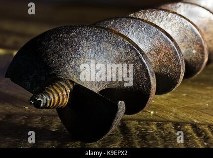 Drill close up. Carpentry. Wooden background. Stock Photo