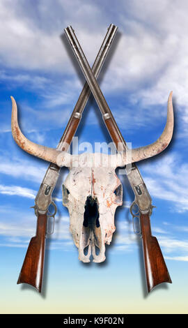 Antique cowboy lever action rifle and cow skulls . Stock Photo