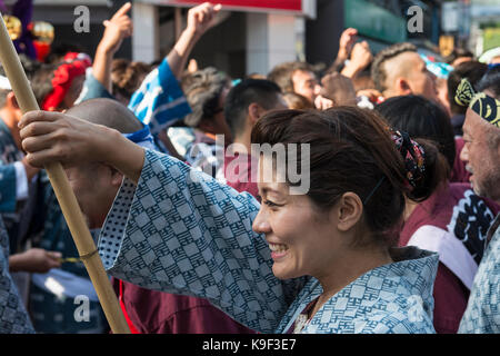 Mikoshi procession of the Kichijoji Autumn Festival (Aki Matsuri) of Musashino Hachimangu Shrine on Heiwa Dori, Kichijoji, Japan Stock Photo