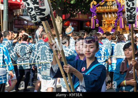 Mikoshi procession of the Kichijoji Autumn Festival (Aki Matsuri) of Musashino Hachimangu Shrine on Heiwa Dori, Kichijoji, Japan Stock Photo