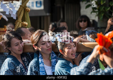 Mikoshi procession of the Kichijoji Autumn Festival (Aki Matsuri) of Musashino Hachimangu Shrine on Heiwa Dori, Kichijoji, Japan Stock Photo