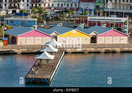 Fort-de-France, Martinique.  Early Morning Fishermen on the Pier by the Souvenir Market for Cruise Ships. Stock Photo