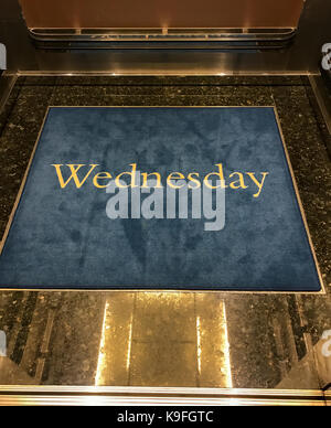 Caribbean Cruise Ship, Nieuw Amsterdam.  Elevator Floor Mats Remind Passengers of the Day. Stock Photo