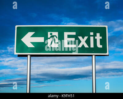 Emergency Exit Sign against a blue sky Stock Photo