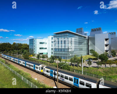 Biomedical Cambridge - MRC Molecular Biology Lab / Train - A London to Cambridge Train  passes the MRC Laboratory of Molecular Biology, Cambridge UK. Stock Photo