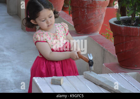 Little Girl Carpenter Stock Photo