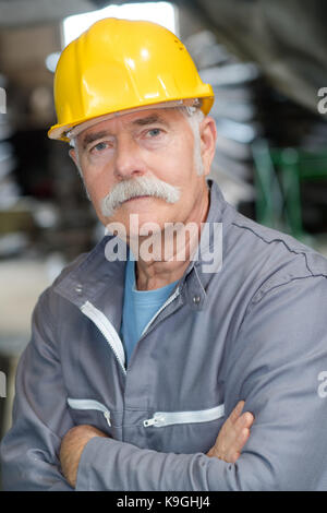 happy smiling senior construction worker or engineer Stock Photo