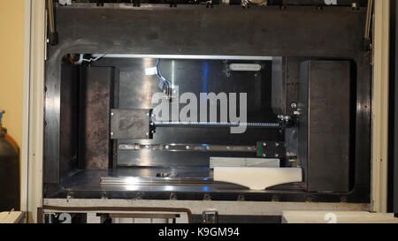Automatic three dimensional 3d printer performs product creation. Modern 3D printing or additive manufacturing and robotic automation technology Stock Photo