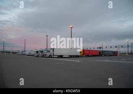 Loading ramp on dock 7 at Calais ferry port, dusk Stock Photo