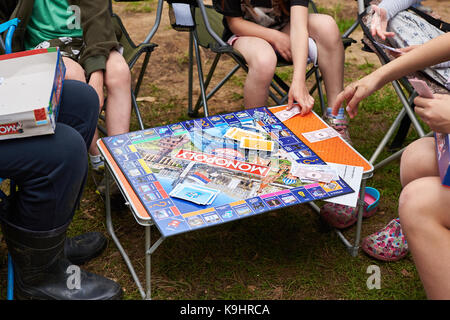 Children play a board game in Monopoly Stock Photo