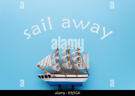 model ship on blue background. freedom concept Stock Photo