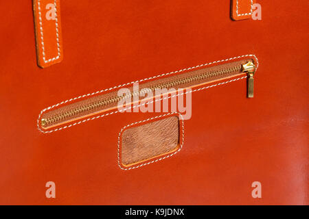 Closeup of brown leather briefcase with brass buckle. High resolution photo. Stock Photo