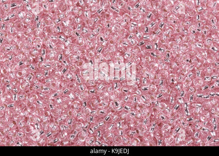 Backdrop with tiny red glass seed beads. High resolution photo. Stock Photo