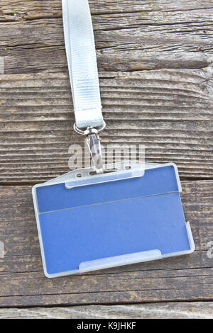 Blank ID card tag on wooden background Stock Photo