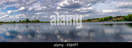 Panorama, taken on a lovely summer day, of the reflections, of the clouds. Stock Photo