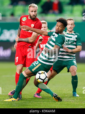 Kenneth Otigba of Ferencvarosi TC tackles Marko Futacs of MOL